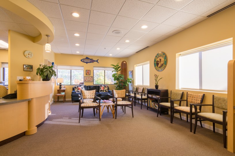 A room with many chairs and tables in it